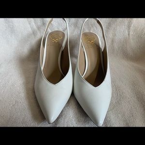 Vince Camuto peekaboo pumps in white
